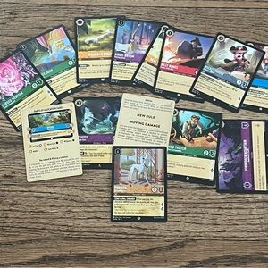 A variety of Disney Lorcana trading cards
